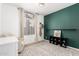 Bright room with modern rug, sleek desk, and a playful accent wall at 328 E Ivy St, Mesa, AZ 85201