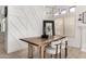 Bright dining room featuring a wood table, stylish chairs, and a modern light fixture at 328 E Ivy St, Mesa, AZ 85201