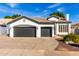 Charming single-story home features a three-car garage and well-manicured landscaping at 328 E Ivy St, Mesa, AZ 85201