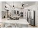 Modern kitchen with stainless steel appliances, an island cooktop, and designer backsplash at 328 E Ivy St, Mesa, AZ 85201