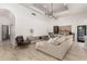 Inviting living room with a large sectional sofa and stylish light fixture at 328 E Ivy St, Mesa, AZ 85201