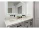 Bright main bathroom featuring double sinks, grey cabinetry and black hardware at 328 E Ivy St, Mesa, AZ 85201