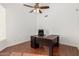 Office featuring dark wood floors, a ceiling fan, and a large desk perfect for working at 328 E Ivy St, Mesa, AZ 85201