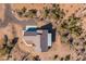 Stunning aerial view of a desert home, showcasing its unique roofline and surrounding landscape at 34515 N 142Nd St, Scottsdale, AZ 85262