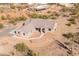 Single Gathering home on an oversized desert lot features serene views and a neutral exterior palette at 34515 N 142Nd St, Scottsdale, AZ 85262