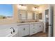 Bathroom features a double vanity, granite countertops, and a soaking tub at 34515 N 142Nd St, Scottsdale, AZ 85262