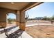 Relaxing covered patio with picturesque desert views and comfortable seating at 34515 N 142Nd St, Scottsdale, AZ 85262