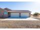 Spacious three-car garage with ample parking space, located in a desert landscape at 34515 N 142Nd St, Scottsdale, AZ 85262