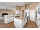 Modern kitchen featuring white cabinetry, granite countertops, and stainless steel appliances at 34515 N 142Nd St, Scottsdale, AZ 85262