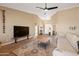 Bright living room featuring a comfortable sofa, modern furnishings, and an open floor plan at 34515 N 142Nd St, Scottsdale, AZ 85262