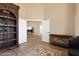 An open-concept living area with tile floors, light-colored walls, white trim, and a decorative rug connects living spaces at 34515 N 142Nd St, Scottsdale, AZ 85262