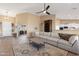 Bright living room with a neutral palette, wood-look floors, and views to other rooms at 34515 N 142Nd St, Scottsdale, AZ 85262