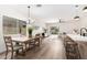 Bright dining area open to the kitchen and living room, with lots of natural light and modern fixtures at 379 W Dragon Tree Ave, San Tan Valley, AZ 85140