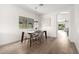 Dining area showcasing a modern light fixture and view into the living space at 379 W Dragon Tree Ave, Queen Creek, AZ 85140