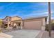 Charming single-story home with desert landscaping and a two-car garage at 379 W Dragon Tree Ave, San Tan Valley, AZ 85140