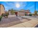 Charming single-story home with desert landscaping and a covered front porch at 379 W Dragon Tree Ave, Queen Creek, AZ 85140