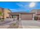 Charming single Gathering home with a well-manicured front yard and a two-car garage at 379 W Dragon Tree Ave, Queen Creek, AZ 85140