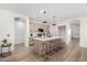 Stylish kitchen with an island, modern pendant lighting, and stainless steel appliances at 379 W Dragon Tree Ave, San Tan Valley, AZ 85140