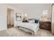 Bright bedroom featuring neutral decor, a comfortable bed with decorative pillows, and two side tables at 3794 E Terrel St, San Tan Valley, AZ 85143