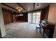 Cozy living room with wood paneling and a piano at 3934 E Sahuaro Dr, Phoenix, AZ 85028