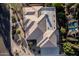 Expansive view of a well-maintained tile roof and desert landscaping from above at 3954 E Florian Ave, Mesa, AZ 85206