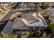 The aerial view of this home displays an excellent roof, desert landscaping, a long driveway and mature trees at 3954 E Florian Ave, Mesa, AZ 85206