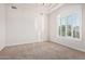 Bedroom features neutral carpet, large window with shutters, and plenty of natural light at 3954 E Florian Ave, Mesa, AZ 85206