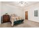 Bedroom with a brass bed, dresser, ceiling fan, carpet floor and a window with white shutters at 3954 E Florian Ave, Mesa, AZ 85206