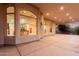 An expansive covered patio features large windows offering glimpses into the interior spaces at 3954 E Florian Ave, Mesa, AZ 85206