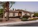 Charming single-story home with neutral paint, a tile roof, and mature landscaping at 3954 E Florian Ave, Mesa, AZ 85206