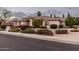 Charming single-story home with neutral paint, a tile roof, and manicured landscaping at 3954 E Florian Ave, Mesa, AZ 85206