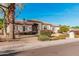 Single-story home with tile roof, neutral paint, desert landscaping, and sidewalk at 3954 E Florian Ave, Mesa, AZ 85206