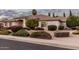 Charming single-story home with neutral paint, a tile roof, and manicured landscaping at 3954 E Florian Ave, Mesa, AZ 85206