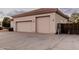 Spacious three car garage with a large concrete driveway at 3954 E Florian Ave, Mesa, AZ 85206