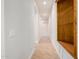 Hallway features tile flooring, arched doorways, recessed lighting, and built-in shelving at 3954 E Florian Ave, Mesa, AZ 85206