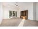 Bright living room features neutral carpet, recessed lighting, and sliding glass door at 3954 E Florian Ave, Mesa, AZ 85206