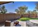 Expansive backyard with a fire pit, hot tub, and lush green lawn perfect for relaxation at 40716 N Hudson Trl, Anthem, AZ 85086