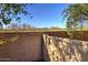 Backyard featuring a desert landscape with a block wall, offering privacy and natural beauty at 40716 N Hudson Trl, Anthem, AZ 85086