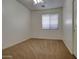 This cozy bedroom features soft carpet, a ceiling fan, and a window for natural light at 40716 N Hudson Trl, Anthem, AZ 85086