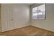 This bright bedroom features a window, closet and plush carpet for comfort and functionality at 40716 N Hudson Trl, Anthem, AZ 85086