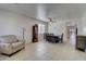 Spacious dining area featuring tile floors, a ceiling fan, and views into other rooms at 40716 N Hudson Trl, Anthem, AZ 85086