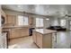 Inviting kitchen with a center island, and ample counter space, seamlessly connecting to the living area at 40716 N Hudson Trl, Anthem, AZ 85086