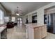 Open layout with tile flooring, connecting the kitchen to the living room, perfect for entertaining at 40716 N Hudson Trl, Anthem, AZ 85086