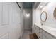 Bathroom featuring a double sink vanity, modern lighting, and a walk-in shower at 4202 E Broadway Rd # 211, Mesa, AZ 85206