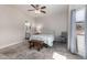 Bright primary bedroom featuring tile floors, and neutral walls, with a bench and a side chair at 4202 E Broadway Rd # 211, Mesa, AZ 85206