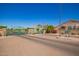 View of a green wrought iron security gate to enter the community at 4202 E Broadway Rd # 211, Mesa, AZ 85206