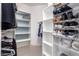 Organized walk-in closet with shelving for shoes and clothing storage in a bright, well-maintained home at 4202 E Broadway Rd # 211, Mesa, AZ 85206