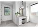 A bright bathroom vanity featuring white cabinets, granite countertops and a view to a shower at 4226 E Marlene Dr, Gilbert, AZ 85296