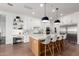 Spacious kitchen with white cabinetry, a large island, stainless steel appliances, and modern pendant lighting at 4226 E Marlene Dr, Gilbert, AZ 85296