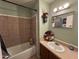 Bathroom with a shower/tub combo, light wall paint, and decor at 451 E Franklin Ave, Mesa, AZ 85204